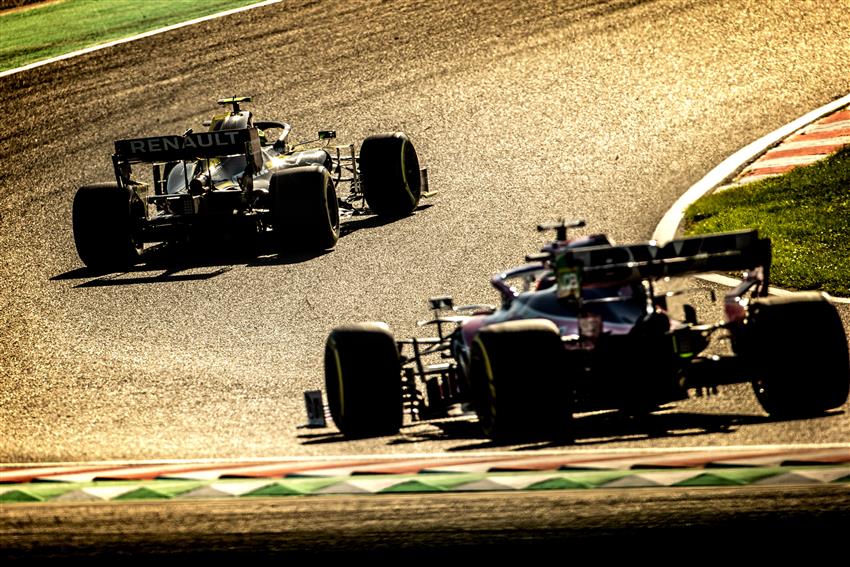 Two F1 cars in sunlight